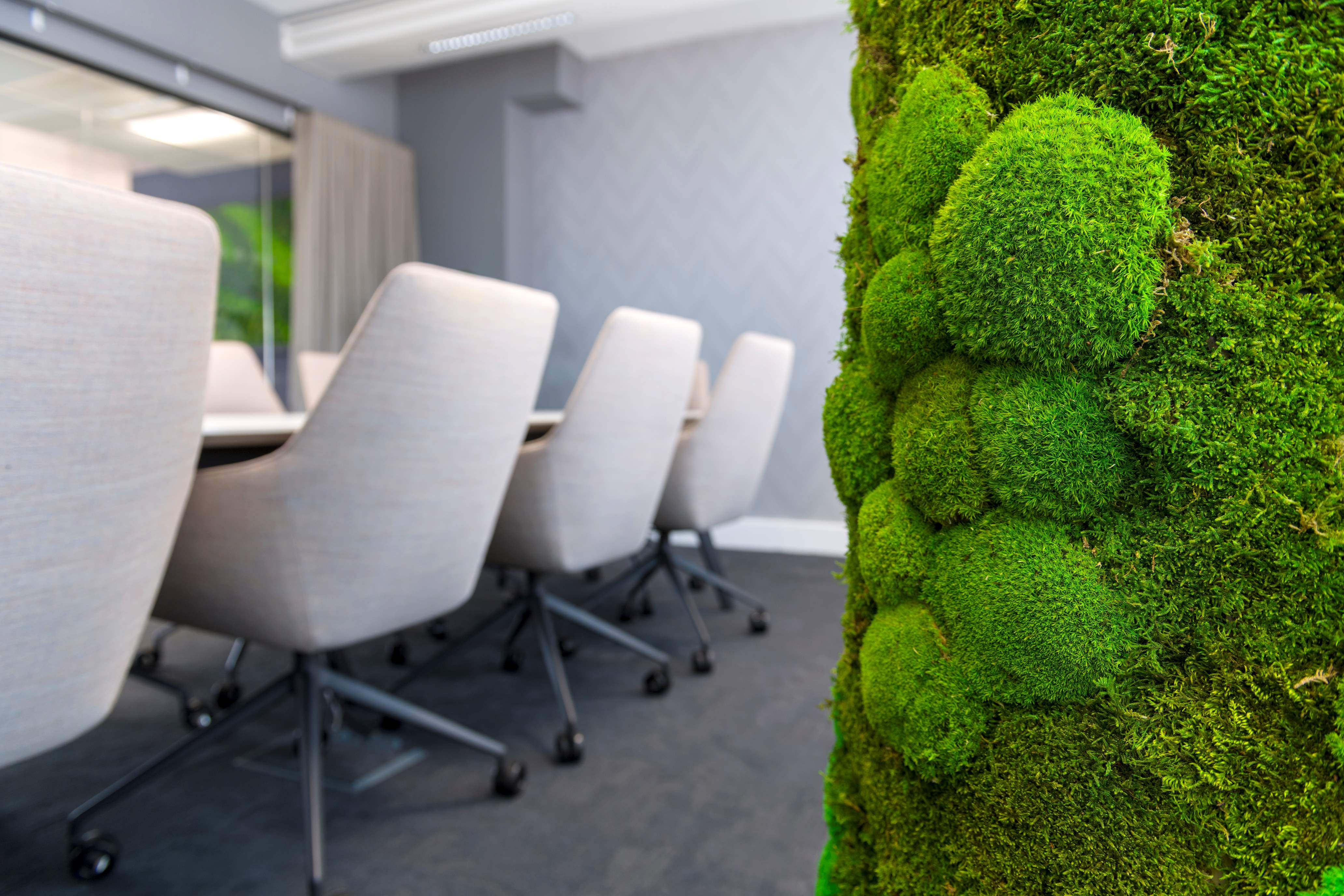 Capital investment boardroom with moss pillar