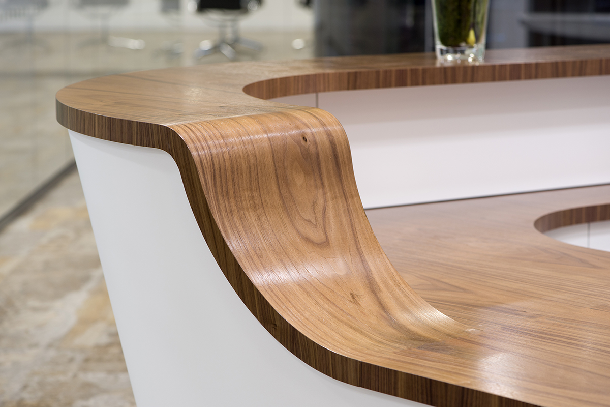 Stylish office interior design curved walnut desktop